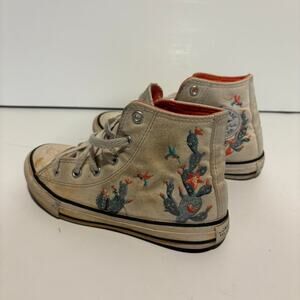 Tan and cream converse all star